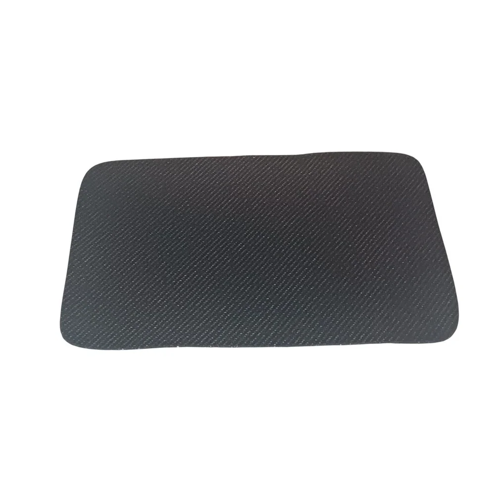 a Small feeding mat, designed to protect floors from spills and messes.